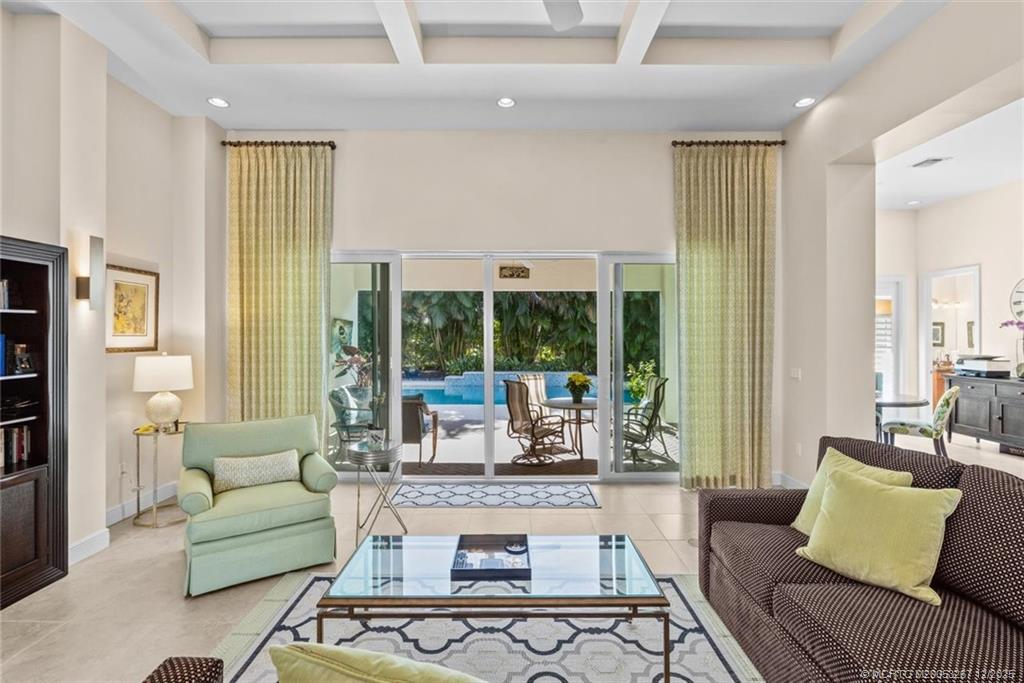 4940 Southeast Inlet Isle Way Stuart, FL 34997 - Photo 15 of 75 a living room with furniture and a large window