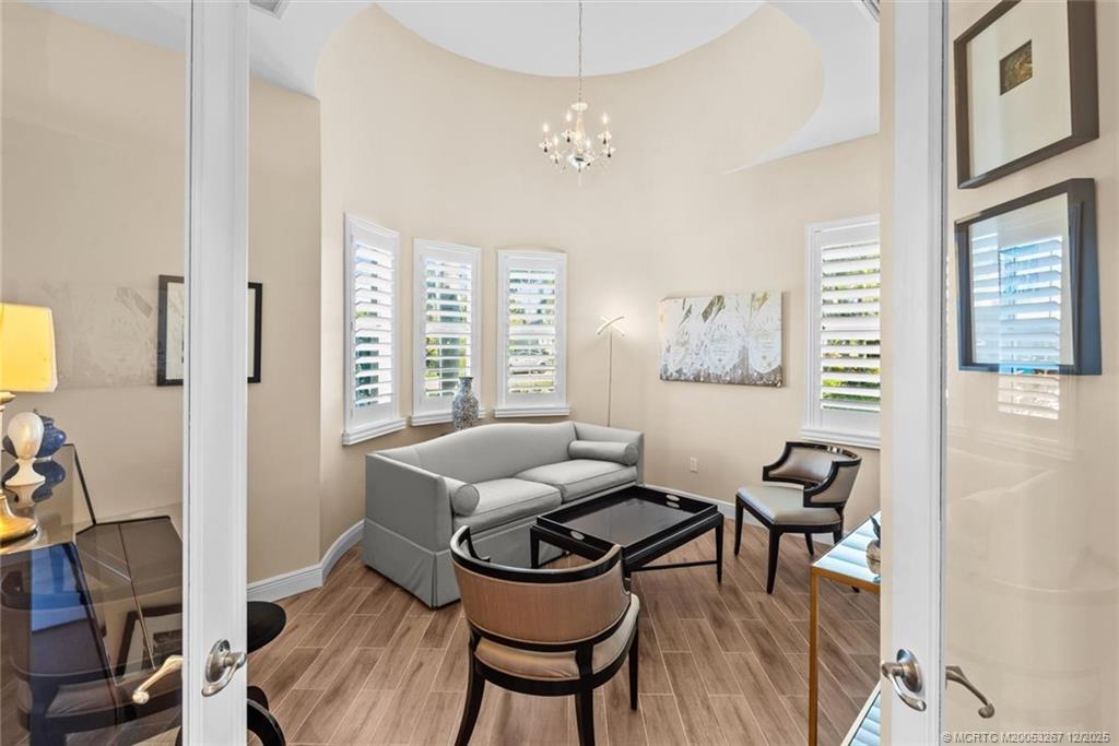 4940 Southeast Inlet Isle Way Stuart, FL 34997 - Photo 24 of 75 a living room with furniture and a window