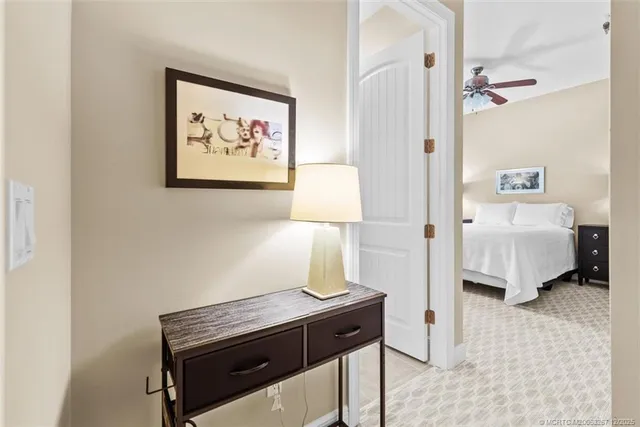 a view of a chairs and table under an umbrella in the patio