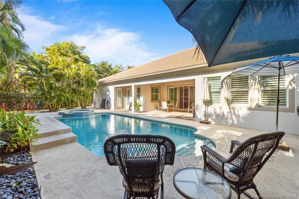 4940 Southeast Inlet Isle Way Stuart, FL 34997 - Photo 51 of 75 a view of a chair and table in the balcony
