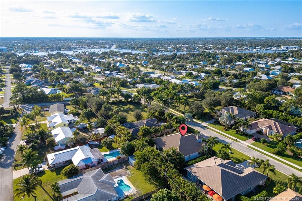 4940 Southeast Inlet Isle Way Stuart, FL 34997 - Photo 72 of 75 an aerial view of a city with lots of residential buildings