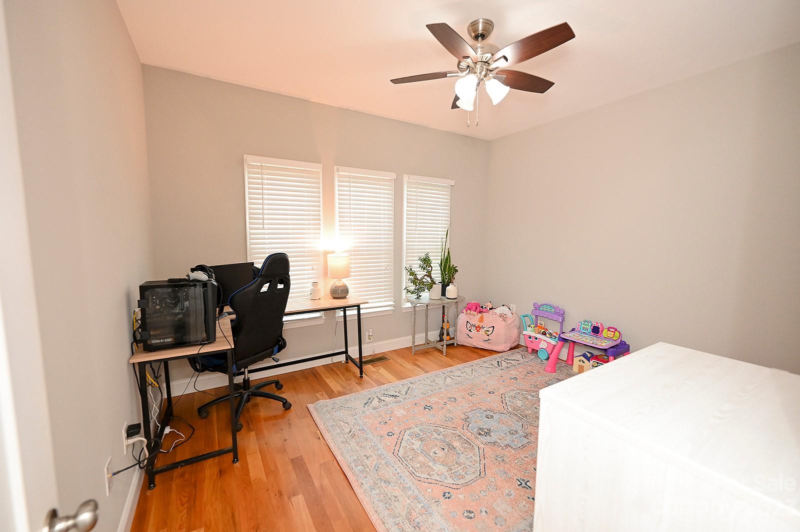 294 East High Road Bostic, NC 28018 - Photo 14 of 25 a bedroom with a bed and wooden floor