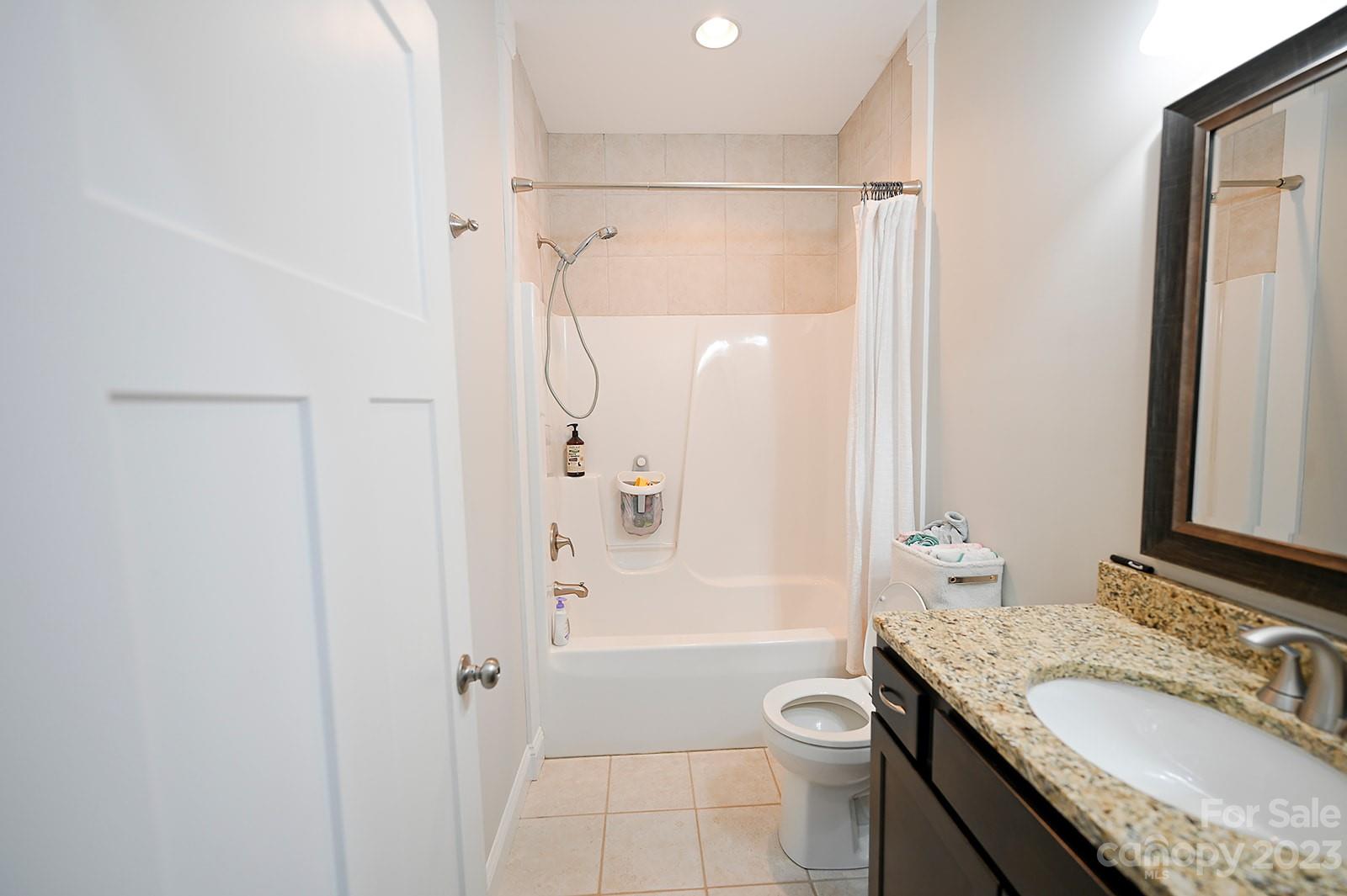 294 East High Road Bostic, NC 28018 - Photo 15 of 25 a bathroom with a granite countertop sink toilet and shower