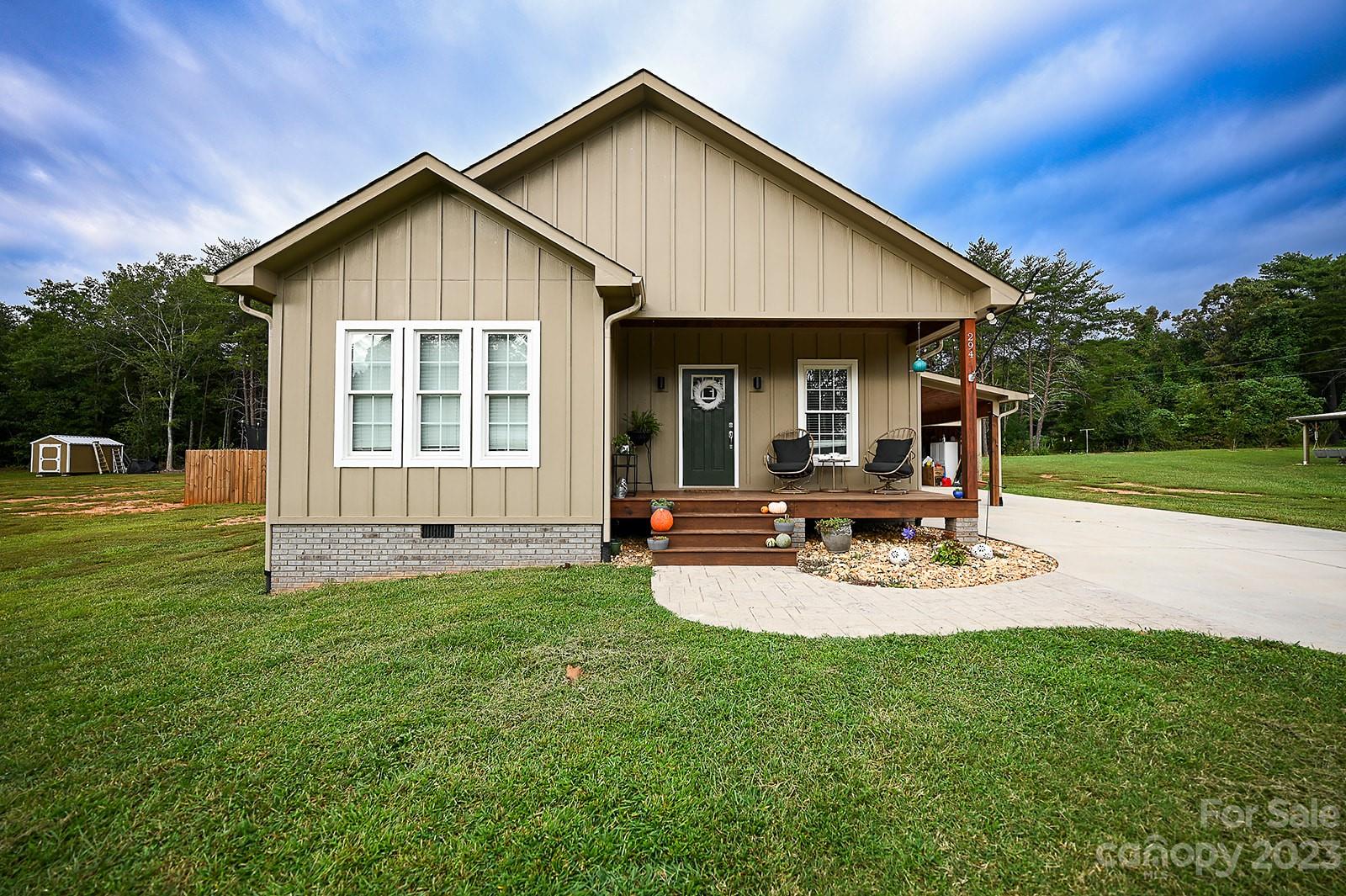 294 East High Road Bostic, NC 28018 - Photo 2 of 25 a view of a house with backyard and sitting area