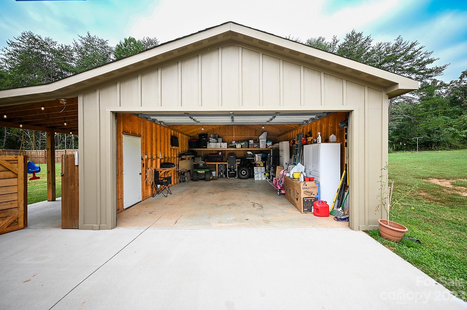 294 East High Road Bostic, NC 28018 - Photo 23 of 25 a view of a patio with table and chairs under an umbrella