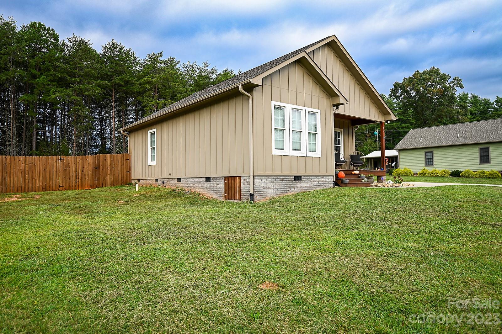 294 East High Road Bostic, NC 28018 - Photo 25 of 25 a view of backyard of house with wooden deck and outdoor seating