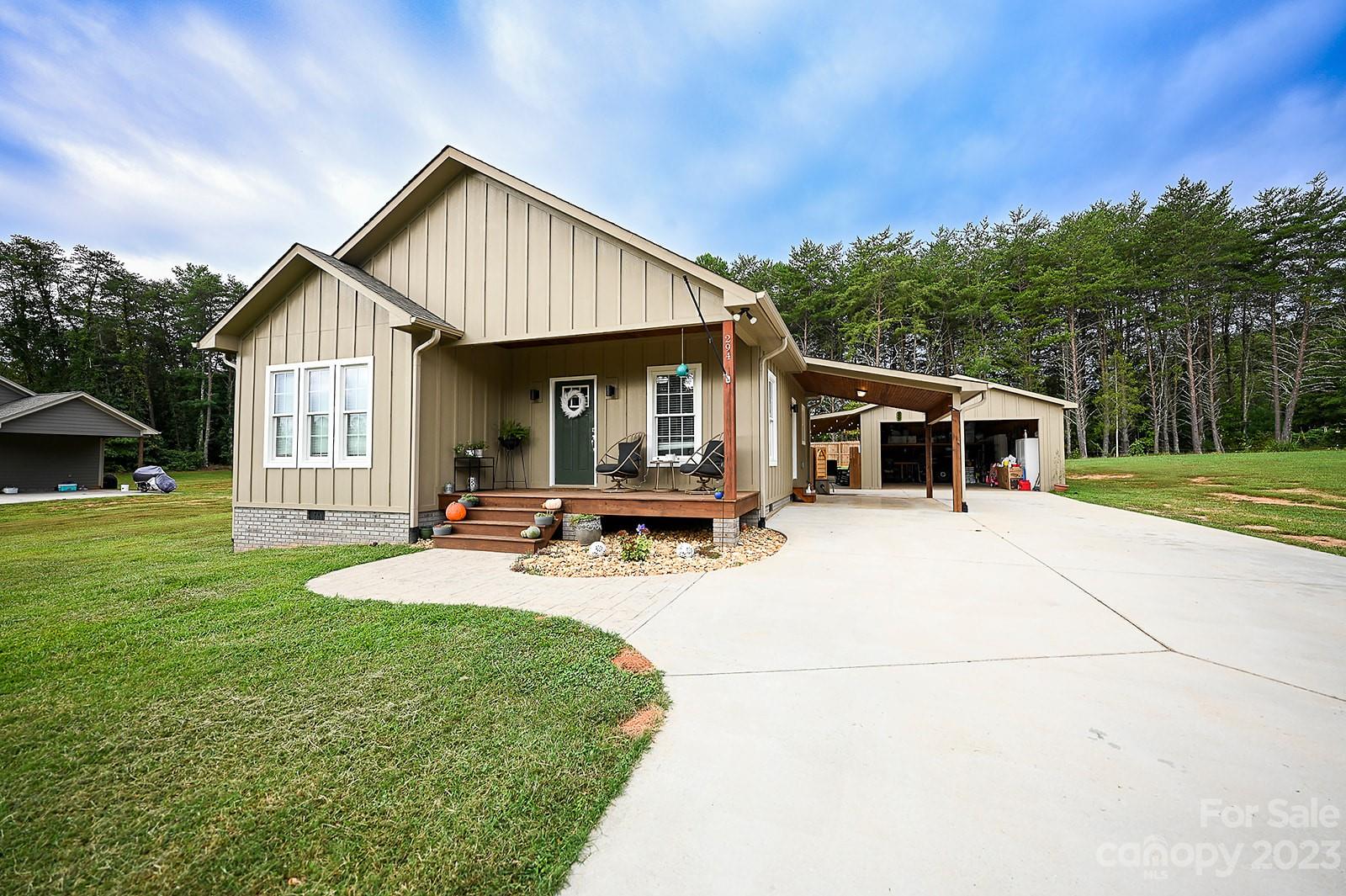 294 East High Road Bostic, NC 28018 - Photo 3 of 25 a view of a house with a yard and sitting area