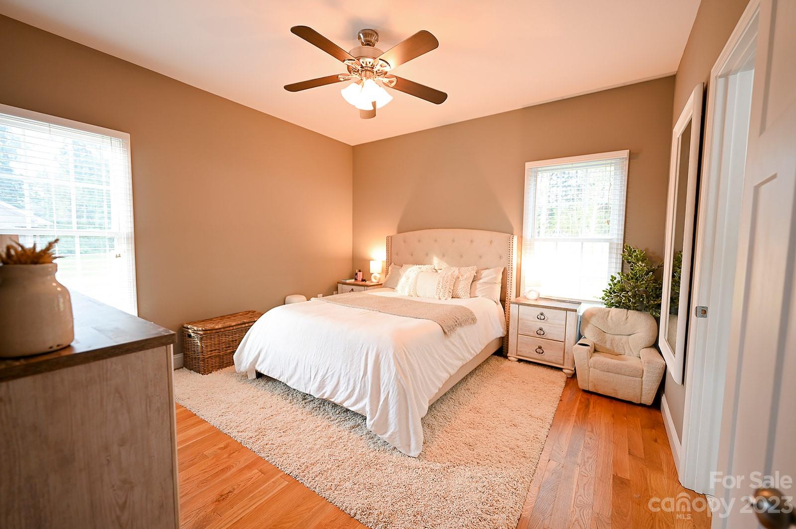 294 East High Road Bostic, NC 28018 - Photo 9 of 25 a bedroom with a large bed and a chandelier