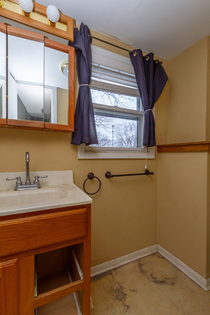 36379 Wesley Road Ingleside, IL 60041 - Photo 12 of 15 a bathroom with a sink and a mirror