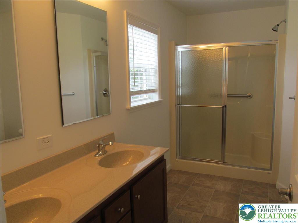 3813 Belcourt Road Easton, PA 18040 - Photo 23 of 25 a bathroom with a sink and a mirror