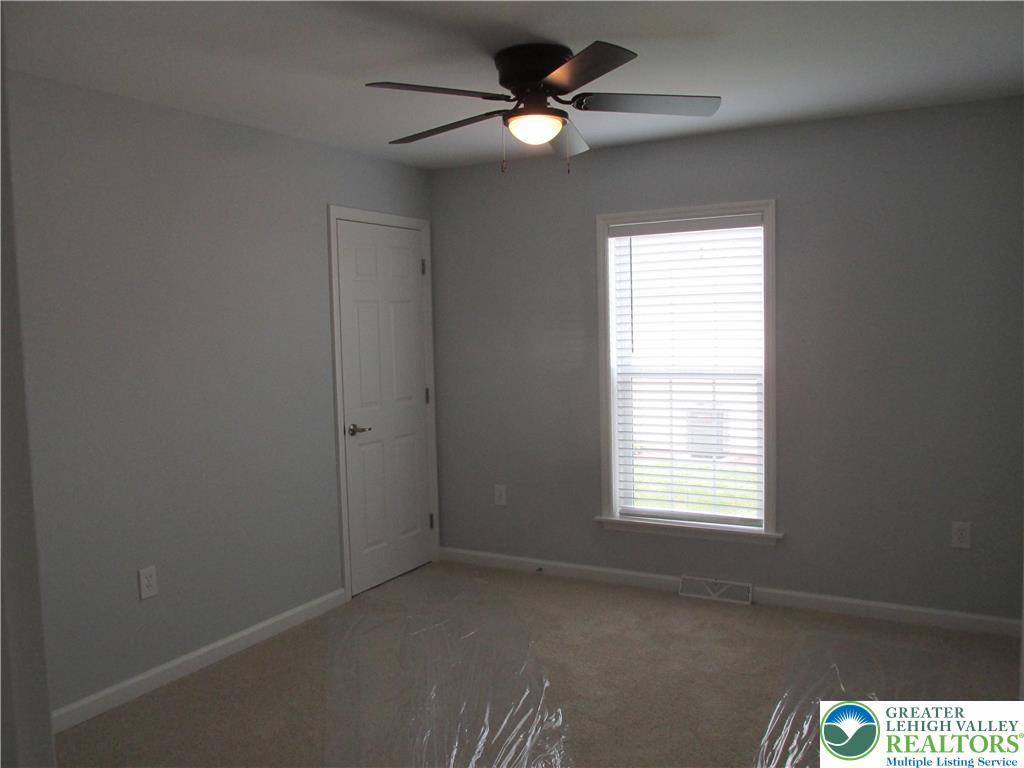 3813 Belcourt Road Easton, PA 18040 - Photo 24 of 25 an empty room with windows and fan