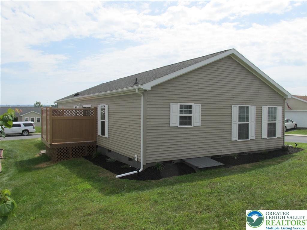 3813 Belcourt Road Easton, PA 18040 - Photo 5 of 25 a view of backyard with a garden and deck
