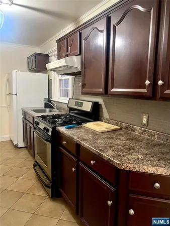 a kitchen with a stove and a sink