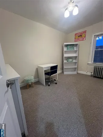 a view of room with furniture and a ceiling fan