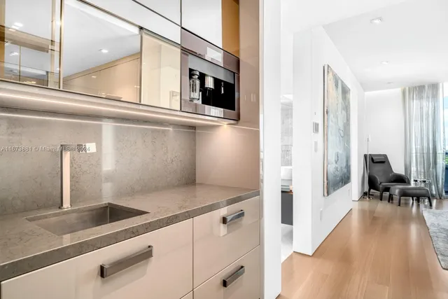 a bedroom with a bed and painting on the wall