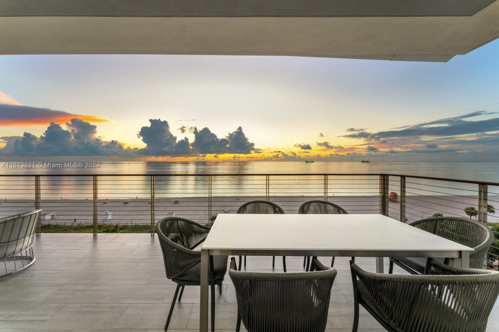 3651 Collins Avenue, Unit 800 Miami Beach, FL 33140 - Photo 28 of 33 a view of a balcony with table and chairs