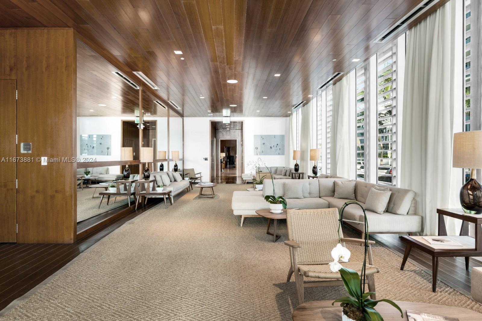 3651 Collins Avenue, Unit 800 Miami Beach, FL 33140 - Photo 31 of 33 a living room with furniture and a large window