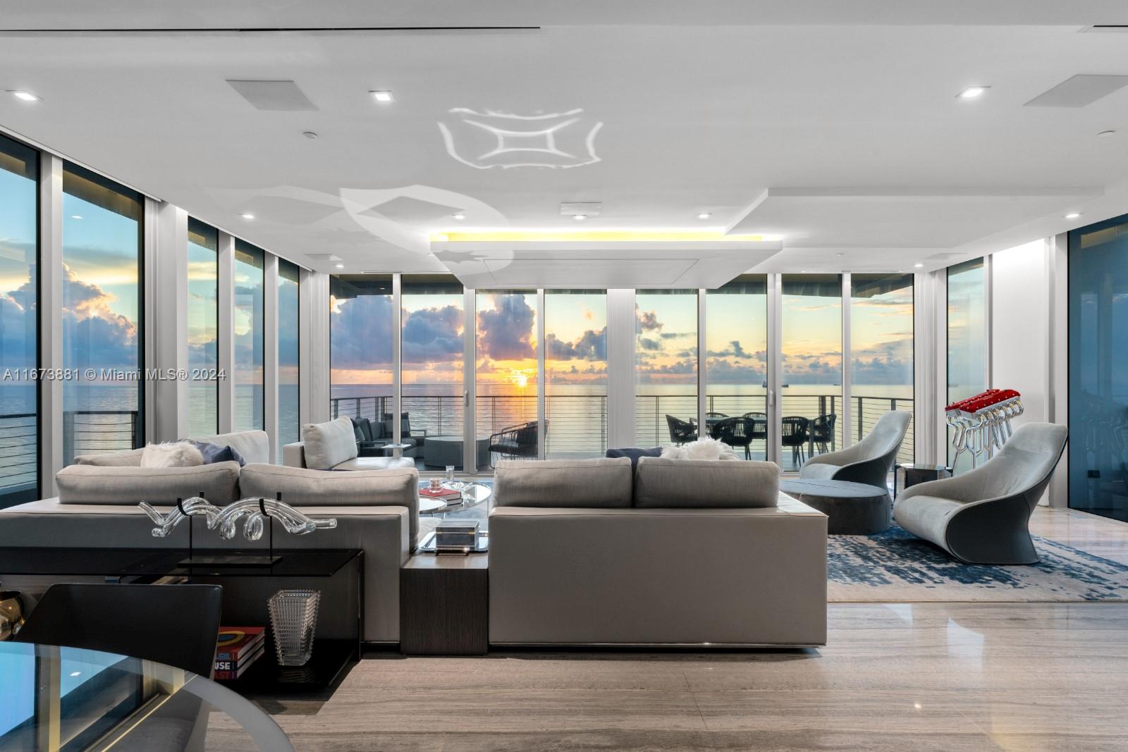 3651 Collins Avenue, Unit 800 Miami Beach, FL 33140 - Photo 10 of 33 a living room with furniture and large windows