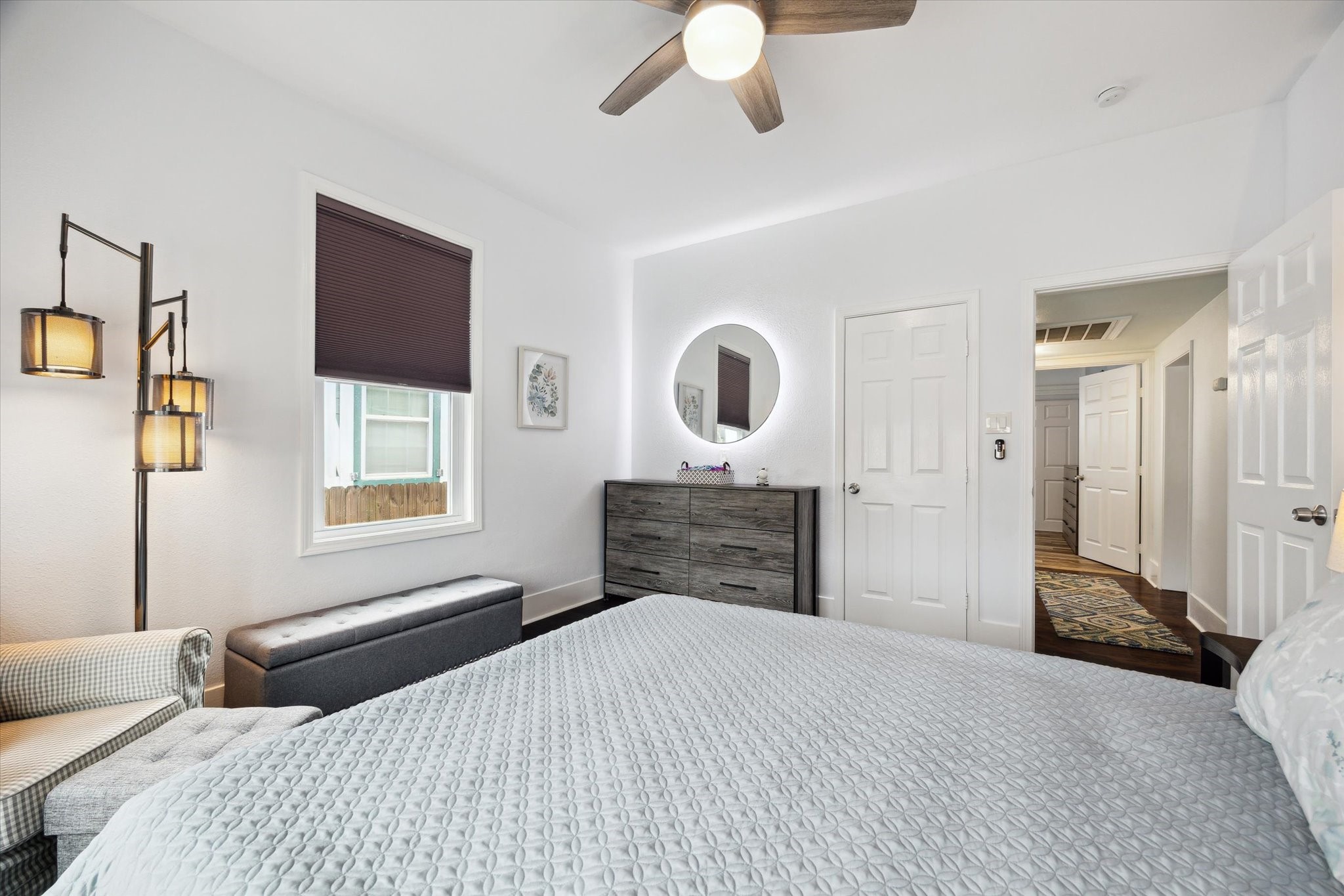 4109 Avenue R Galveston, TX 77550 - Photo 12 of 18 This front bedroom offers a sleek backlit mirror and a spacious closet.