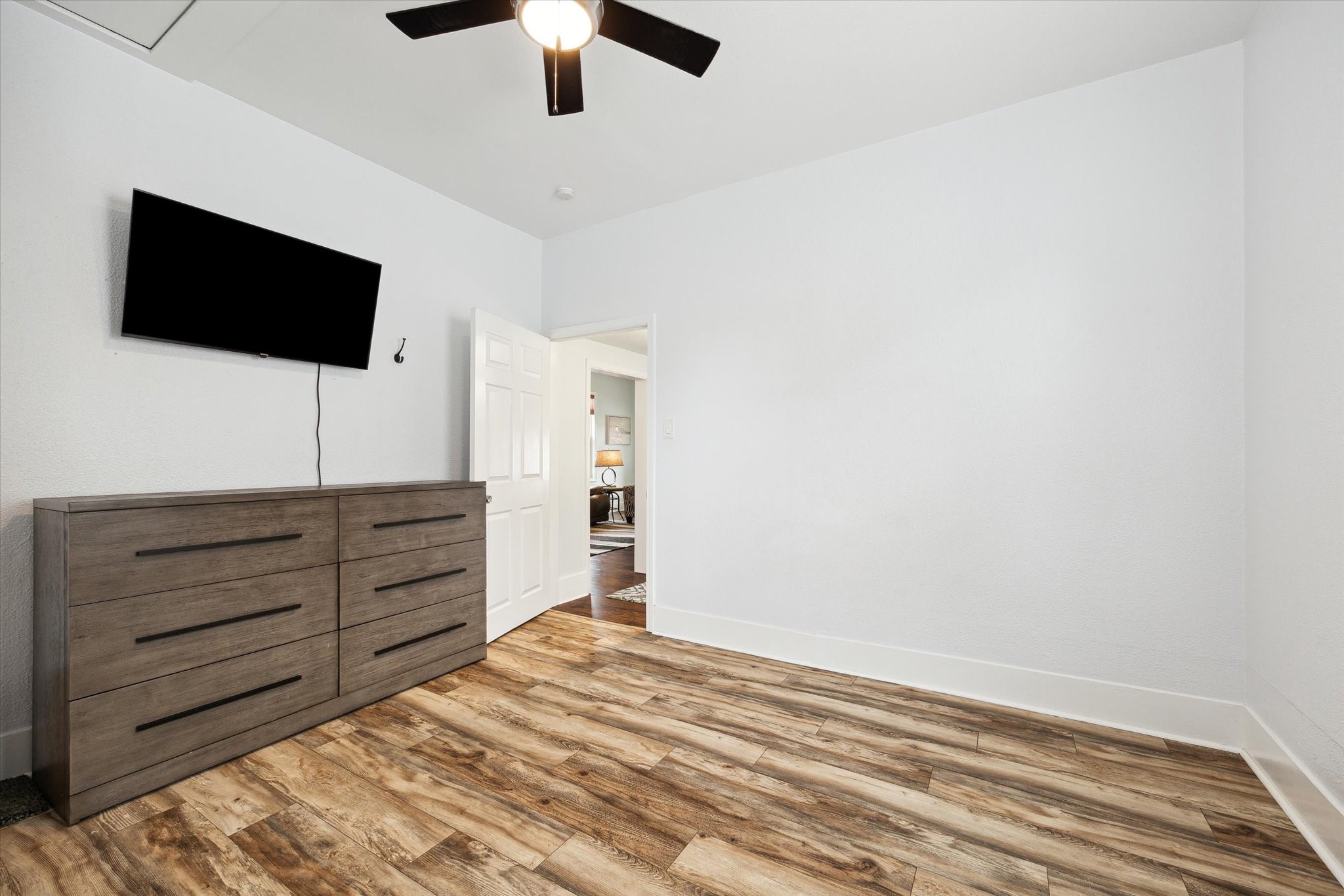 4109 Avenue R Galveston, TX 77550 - Photo 15 of 18 The second guest room also boasts elegant wood flooring.