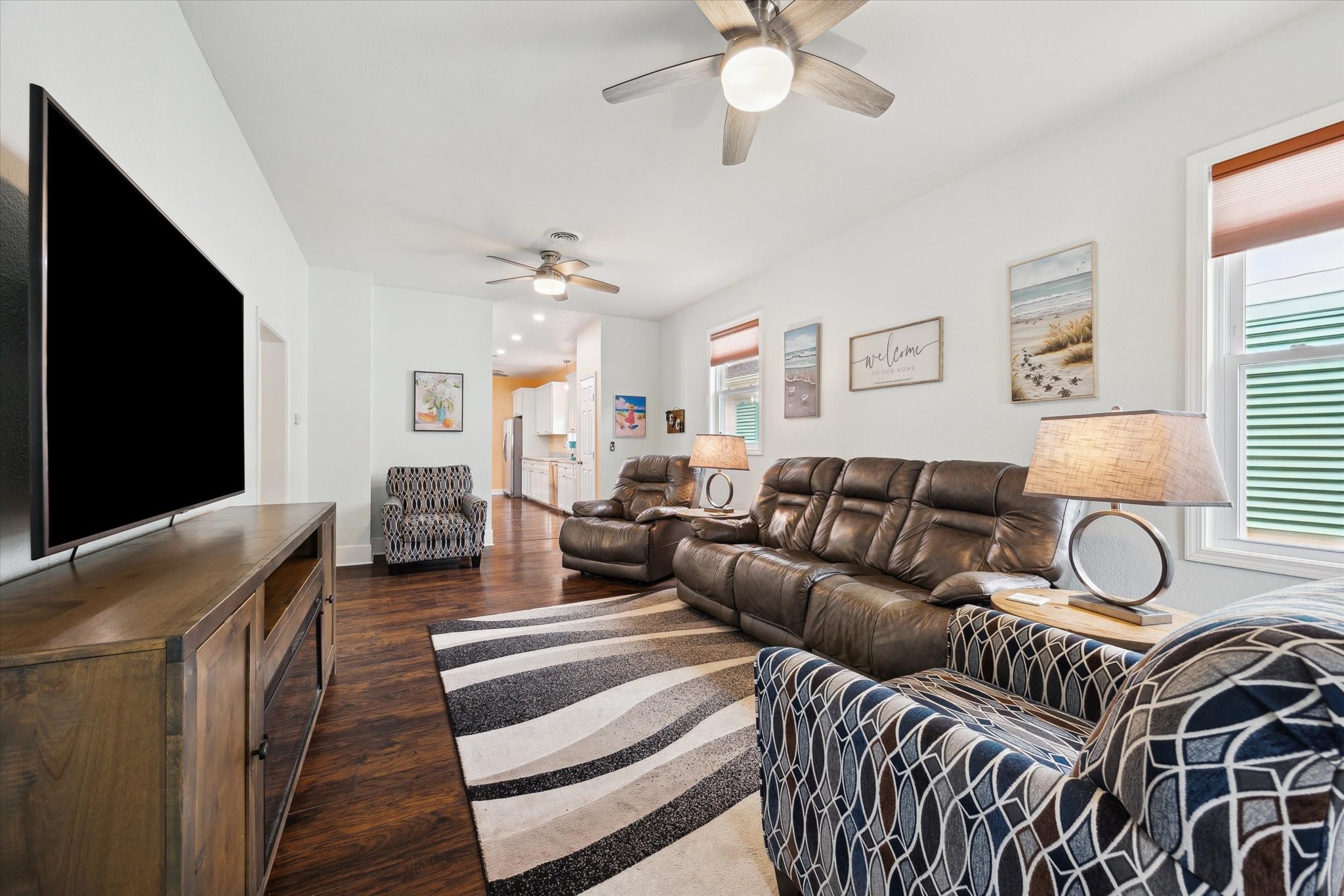 4109 Avenue R Galveston, TX 77550 - Photo 4 of 18 Step into a spacious living room perfect for entertaining, featuring lovely wood flooring that flows throughout most of the home.