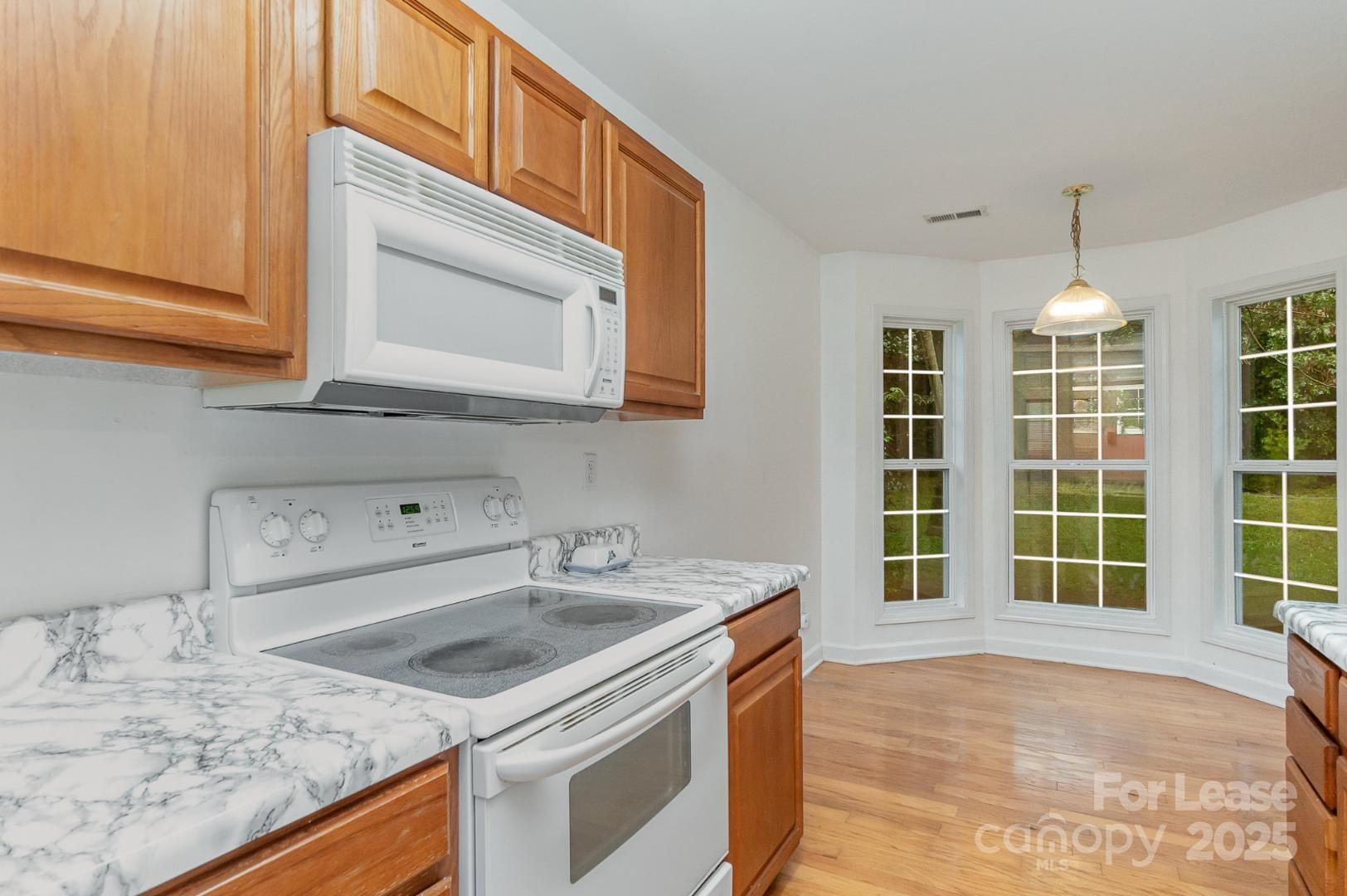 2716 Rabbit Ridge Drive Bessemer City, NC 28016 - Photo 3 of 15 a kitchen with stainless steel appliances granite countertop a sink and a cabinets