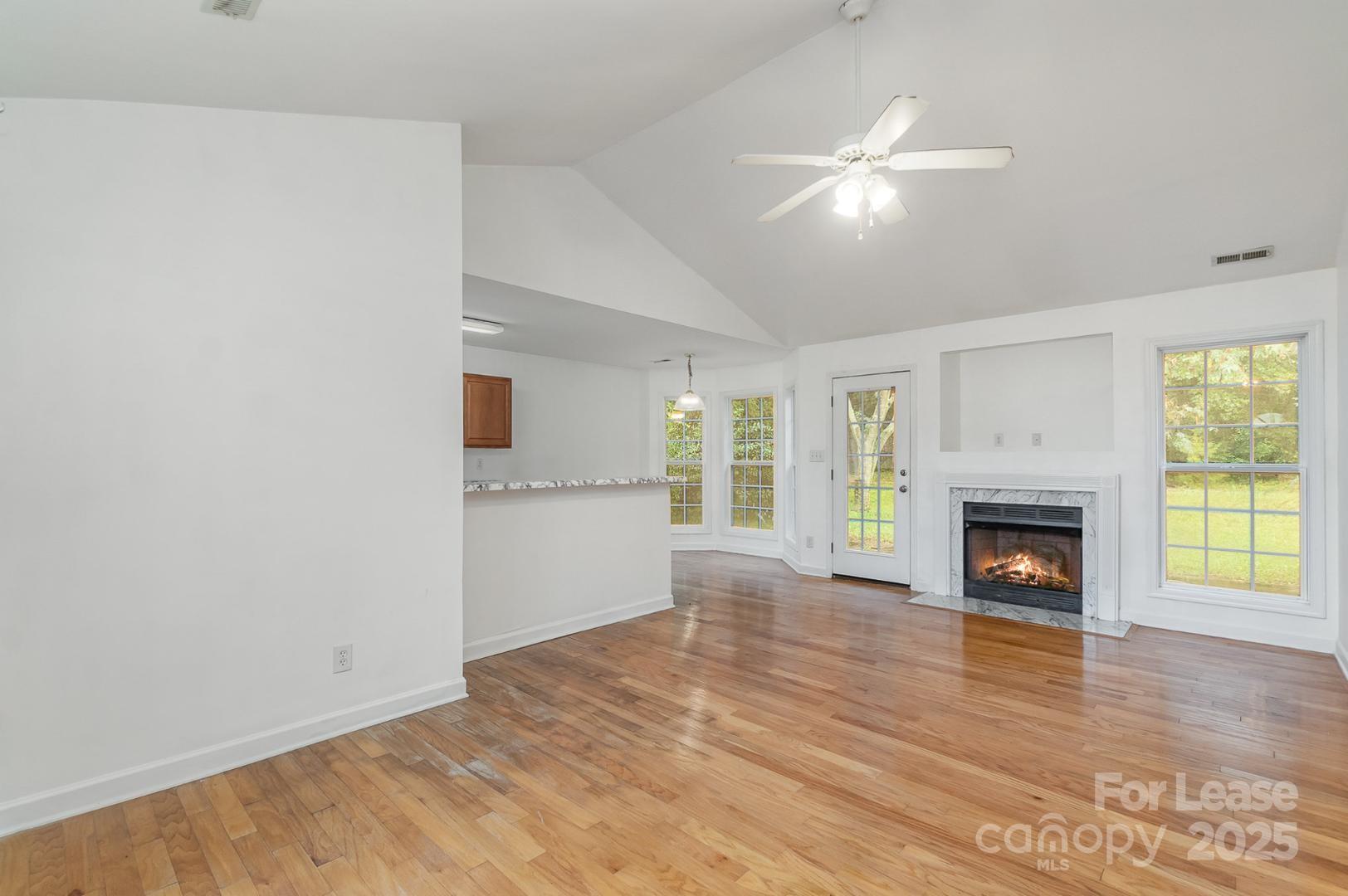 2716 Rabbit Ridge Drive Bessemer City, NC 28016 - Photo 5 of 15 a view of an empty room with window and fire place