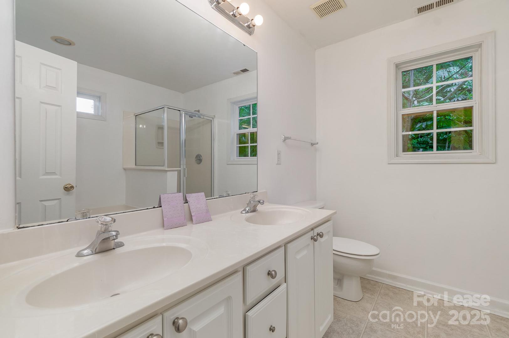 2716 Rabbit Ridge Drive Bessemer City, NC 28016 - Photo 9 of 15 a bathroom with a toilet sink and mirror