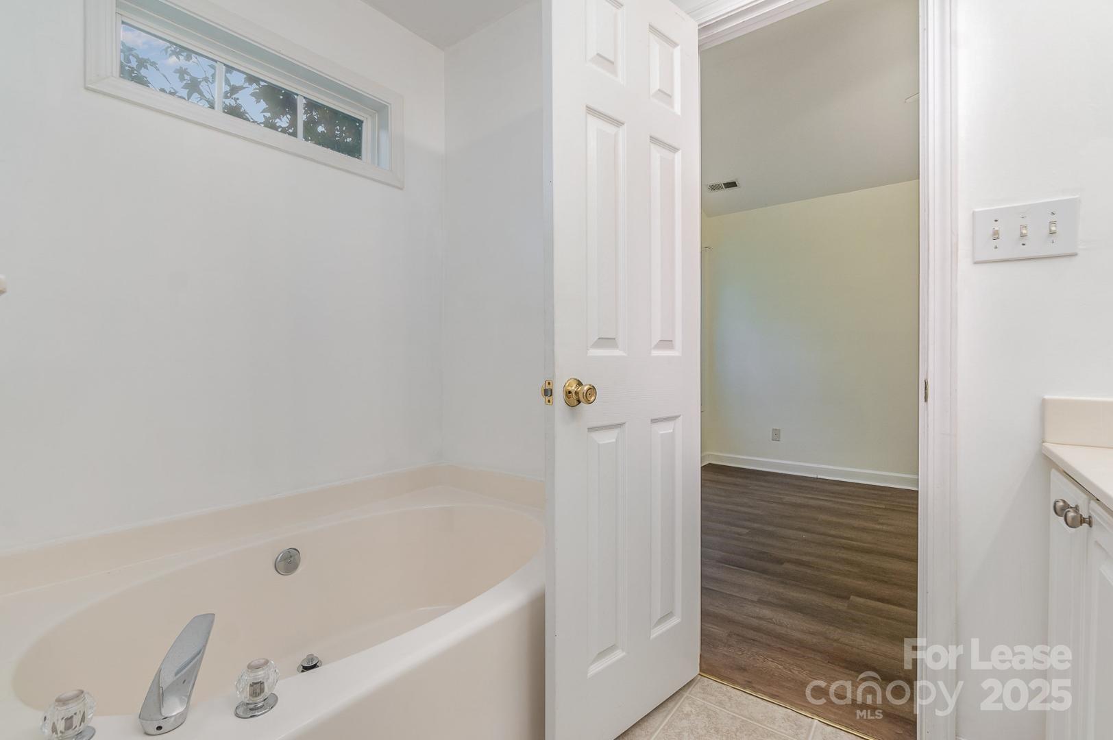 2716 Rabbit Ridge Drive Bessemer City, NC 28016 - Photo 10 of 15 a bathroom with a bathtub