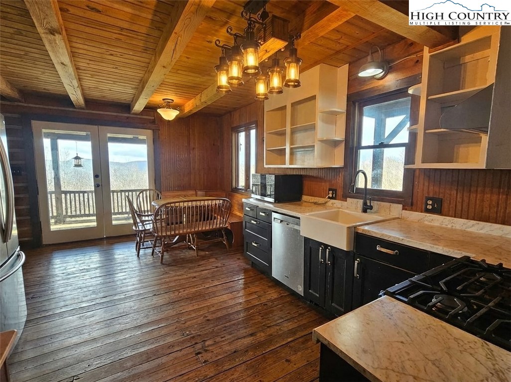 480 Schoolhouse Ridge Boone, NC 28607 - Photo 7 of 47 a kitchen with sink cabinets and wooden floor