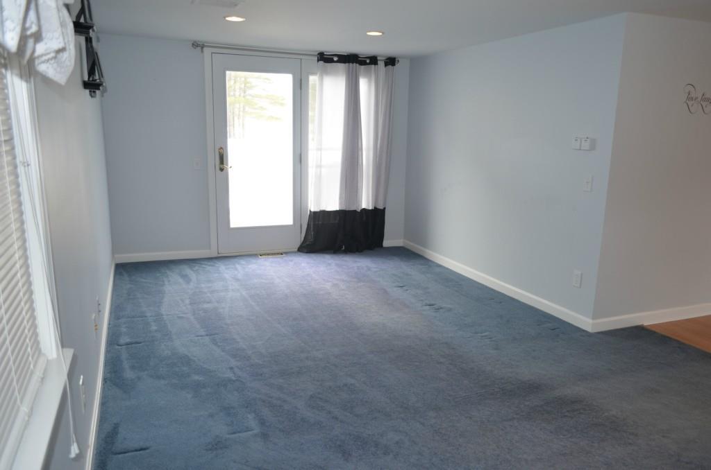 Living room with double doors to...