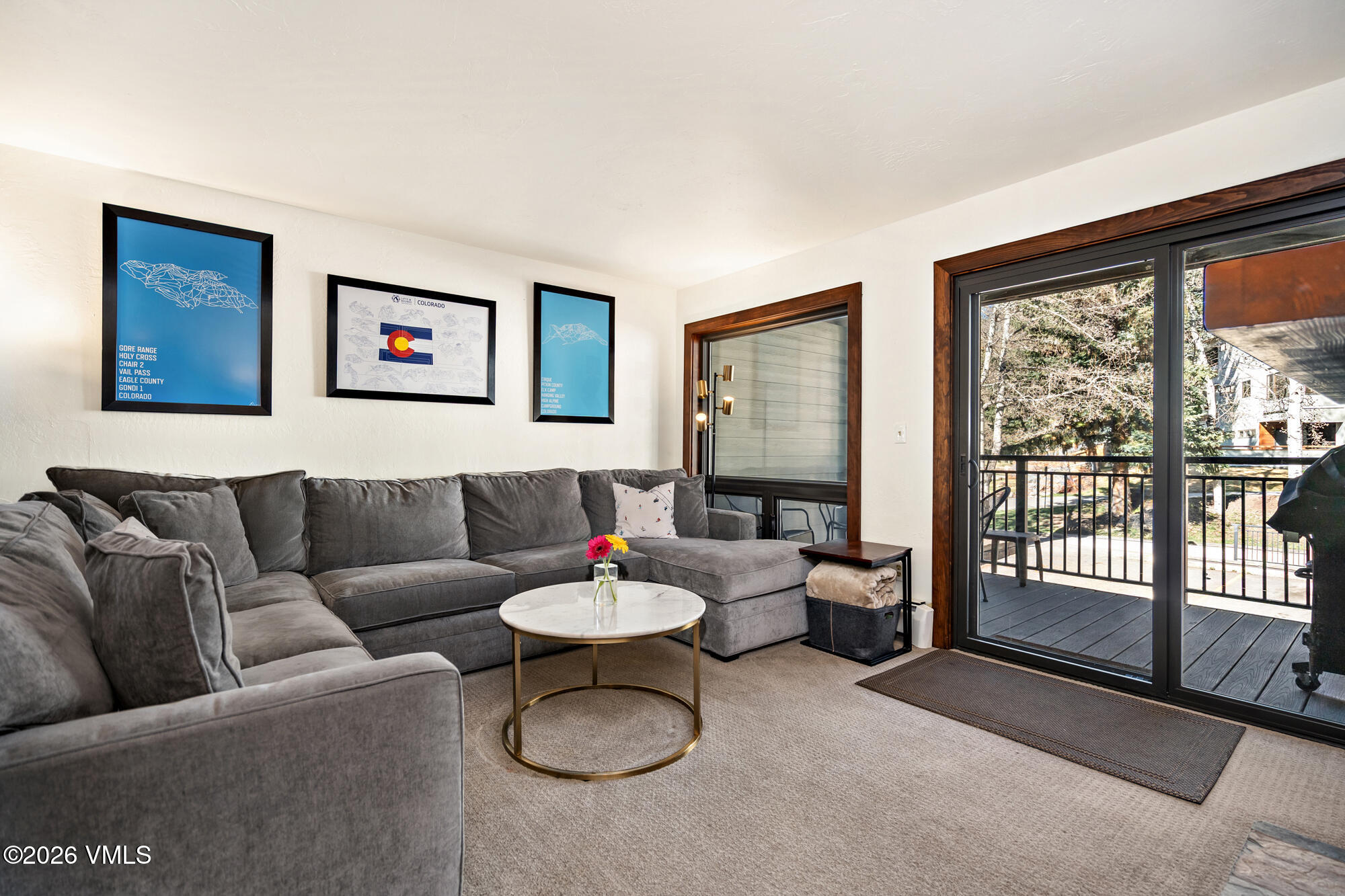 963 Lions Ridge Loop, Unit 502 Vail, CO 81657 - Photo 2 of 30 a living room with furniture and a floor to ceiling window