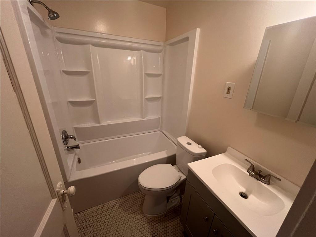 460 Reed Street, Unit 2L Pittsburgh, PA 15221 - Photo 11 of 13 a bathroom with a sink a toilet and shower