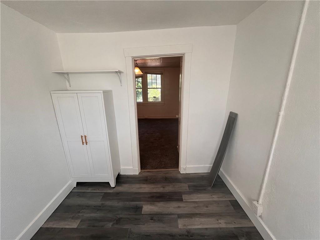 460 Reed Street, Unit 2L Pittsburgh, PA 15221 - Photo 8 of 13 a view of an empty room with wooden floor and a window