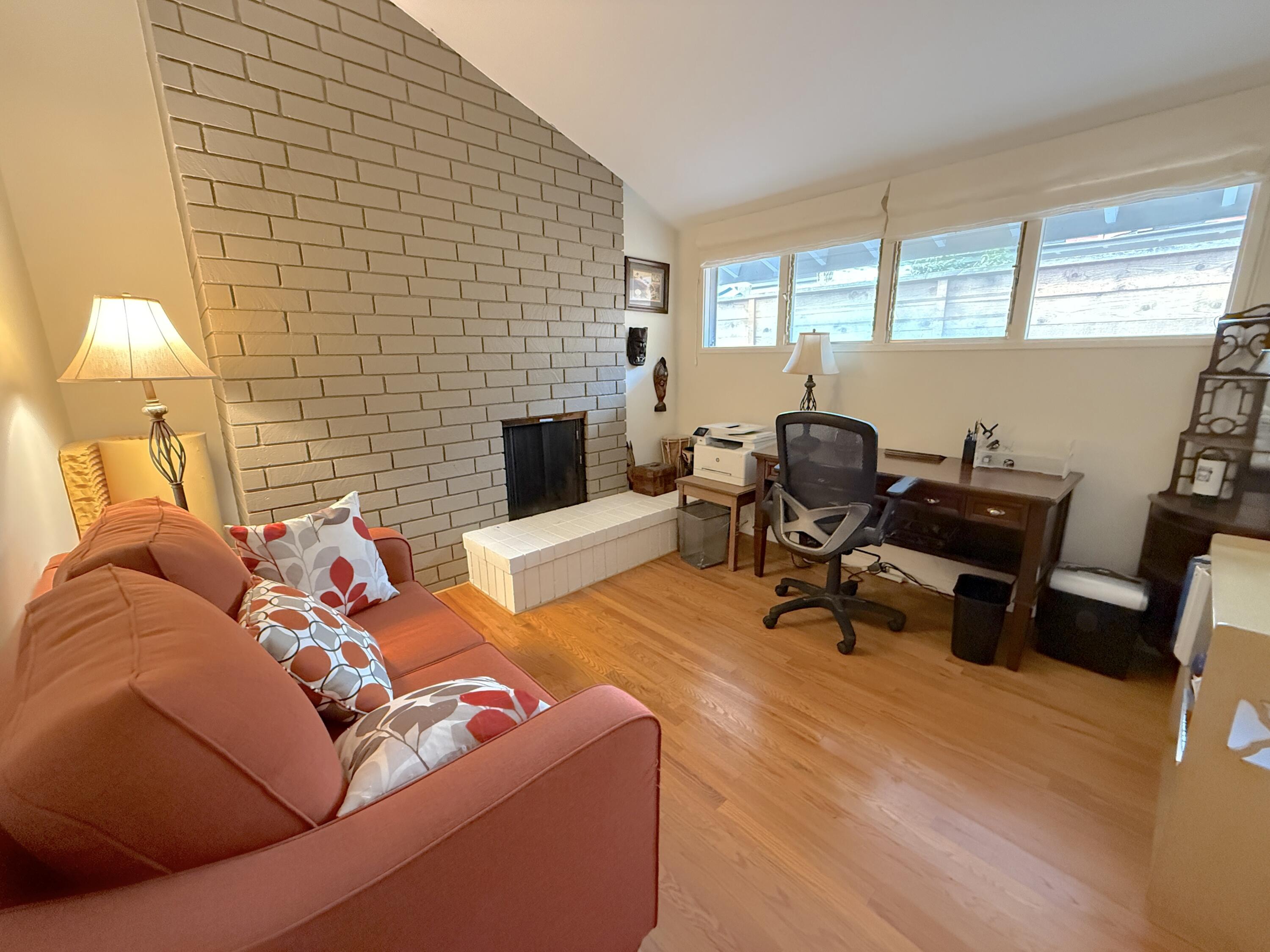 345 North Ontare Road Santa Barbara, CA 93105 - Photo 12 of 14 a living room with furniture and a fireplace