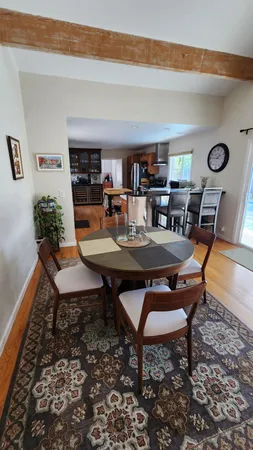 a dining room with furniture and window