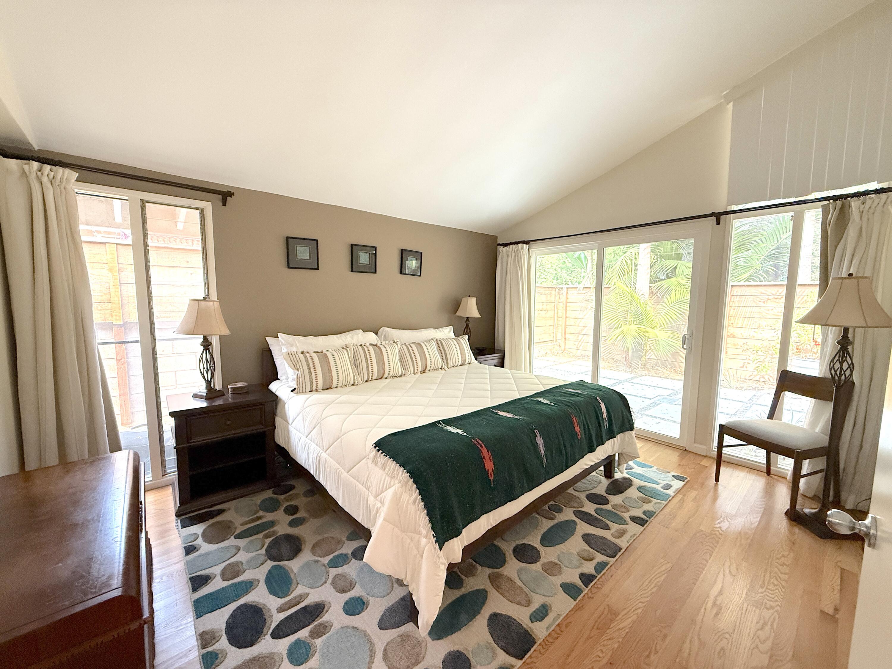 345 North Ontare Road Santa Barbara, CA 93105 - Photo 7 of 14 a bedroom with a bed and a large window