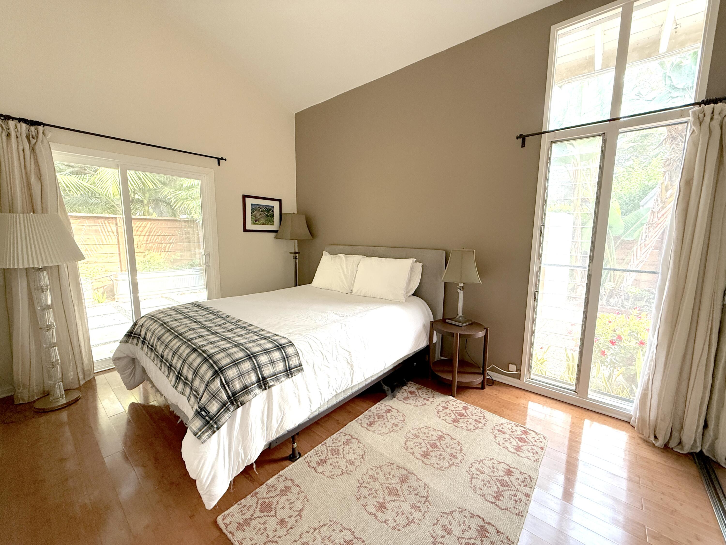 345 North Ontare Road Santa Barbara, CA 93105 - Photo 10 of 14 a bedroom with a bed and a large window
