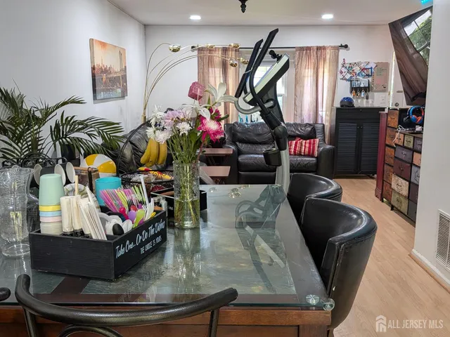 a view of a living room with furniture and a flat screen tv
