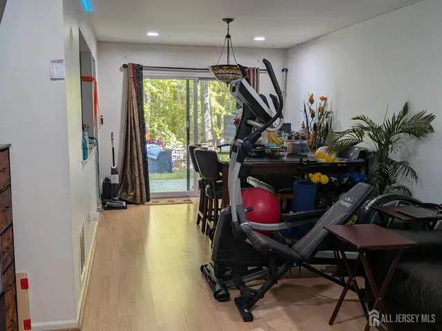 a kitchen with refrigerator and cabinets