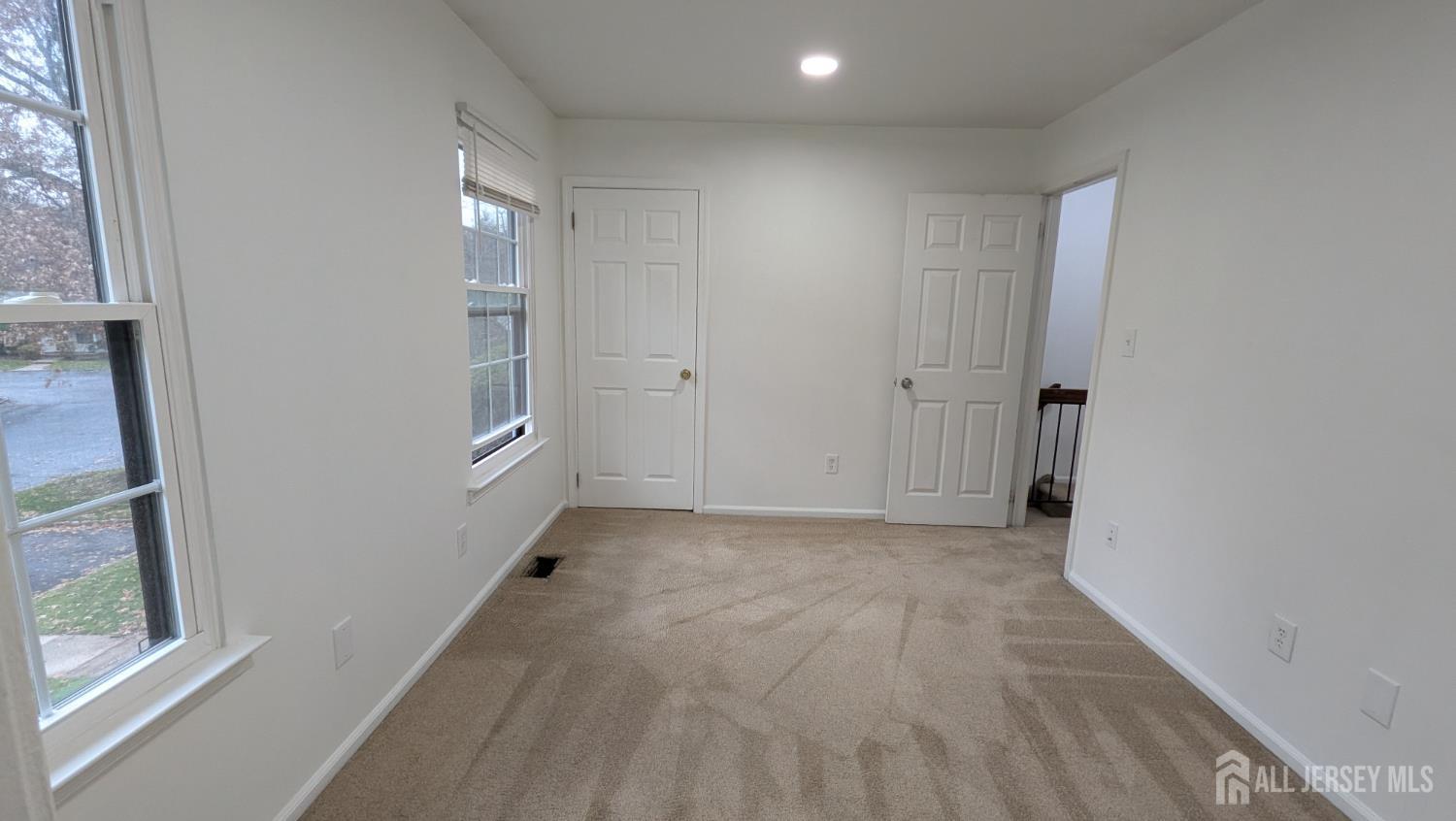 2103 Timber Oaks Road Edison, NJ 08820 - Photo 7 of 14 a view of hallway with a window and a bathroom