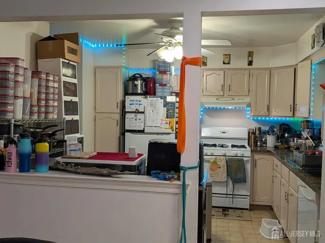 a kitchen with a sink cabinets and appliances