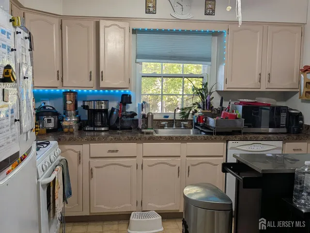 a living room with furniture and a book shelf