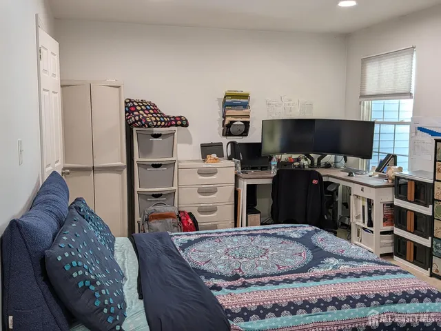 a room with furniture a rug and a window