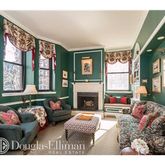 a bedroom with furniture and a fireplace