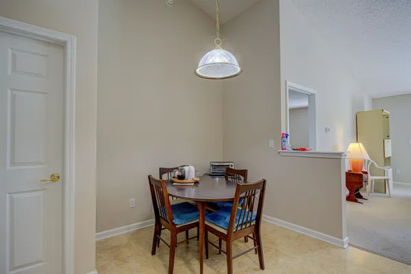 a view of dining room with furniture and wooden floor
