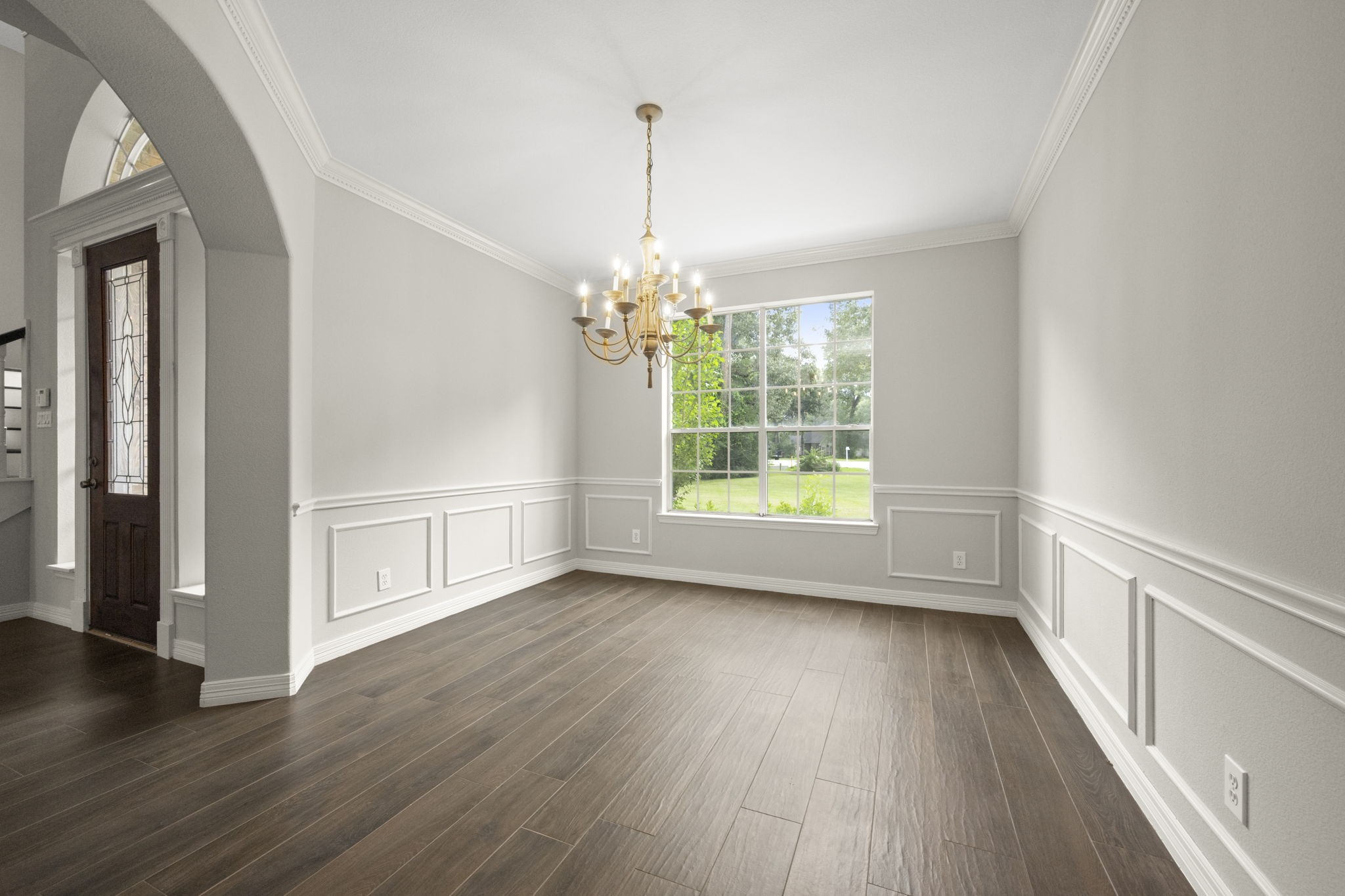 2326 Timbergreen Circle Magnolia, TX 77355 - Photo 13 of 43 an empty room with wooden floor and windows
