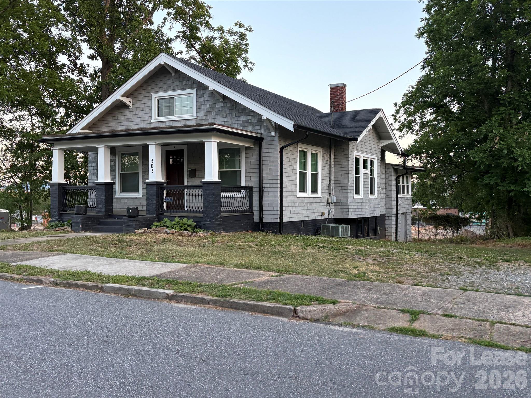 303 Bouchelle Street Morganton, NC 28655 - Photo 2 of 12 a front view of a house with a yard