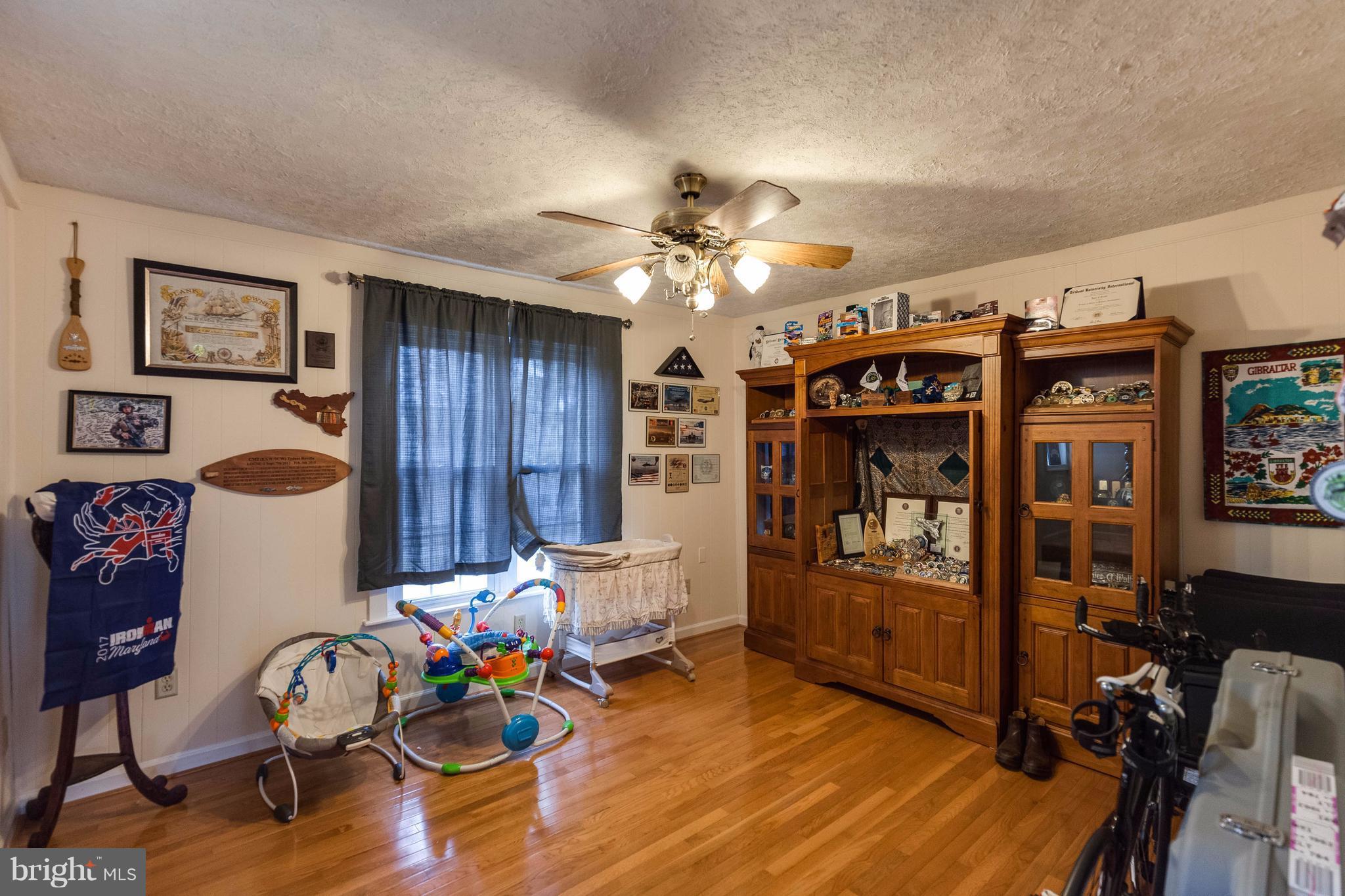 25453 Highfield Road Cascade, MD 21719 - Photo 11 of 30 a living room with furniture and wooden floor