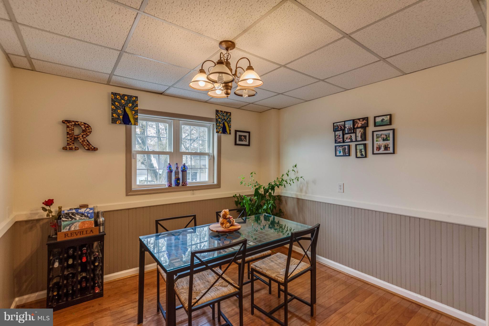 25453 Highfield Road Cascade, MD 21719 - Photo 12 of 30 a view of a dining room with furniture wooden floor and a chandelier